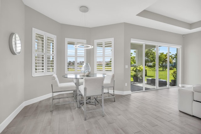 15187 Goldfinch Cir, Westlake, FL 33470 - dining space featuring wood finished floors, plenty of natural light, and a chandelier