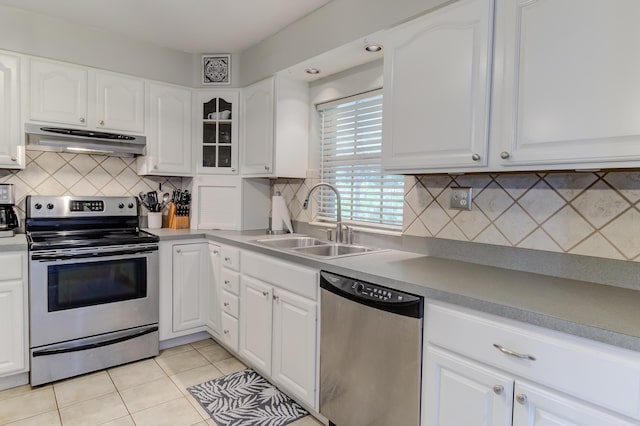 925 SW All American Blvd, Palm City, FL 34990 - kitchen with stainless steel appliances, under cabinet range hood, and white cabinets