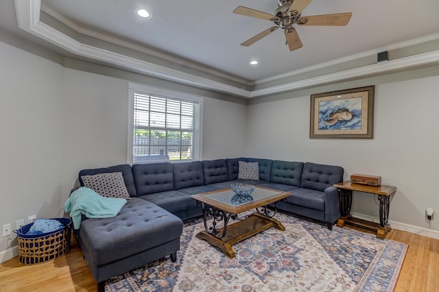 925 SW All American Blvd, Palm City, FL 34990 - living room featuring ornamental molding, wood finished floors, a tray ceiling, ceiling fan, and recessed lighting