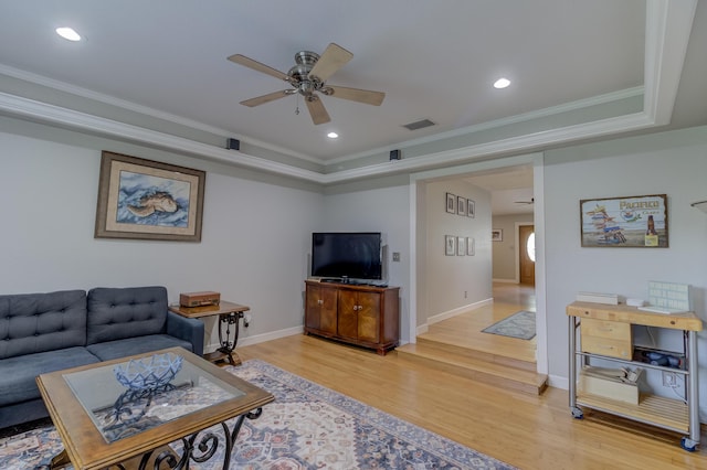 925 SW All American Blvd, Palm City, FL 34990 - living area featuring a ceiling fan, light wood finished floors, crown molding, a raised ceiling, and recessed lighting