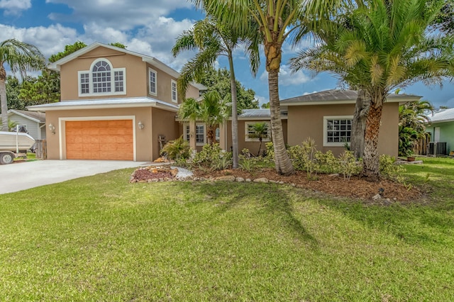 925 SW All American Blvd, Palm City, FL 34990 - view of front of home featuring stucco siding, an attached garage, concrete driveway, and a front lawn