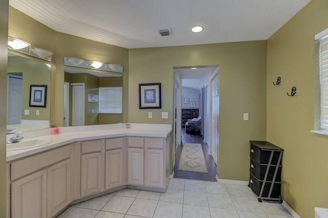 925 SW All American Blvd, Palm City, FL 34990 - ensuite bathroom featuring tile patterned flooring, vanity, and recessed lighting