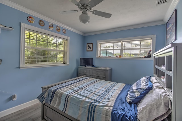925 SW All American Blvd, Palm City, FL 34990 - bedroom featuring wood finished floors, crown molding, and a ceiling fan
