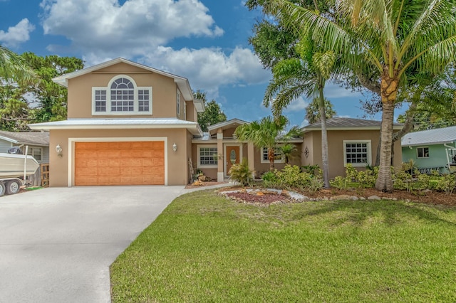 925 SW All American Blvd, Palm City, FL 34990 - traditional home featuring stucco siding, an attached garage, driveway, and a front lawn