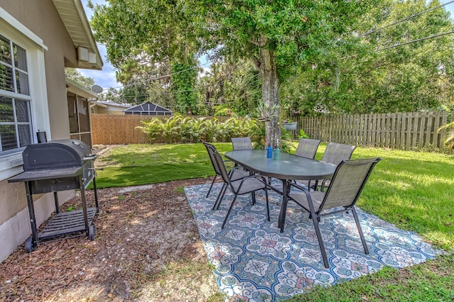 925 SW All American Blvd, Palm City, FL 34990 - fenced backyard featuring outdoor dining space and a patio area