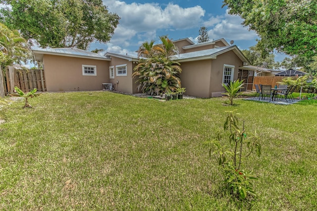 925 SW All American Blvd, Palm City, FL 34990 - rear view of house featuring stucco siding, a patio area, and a metal roof