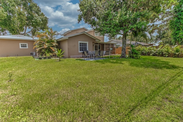 925 SW All American Blvd, Palm City, FL 34990 - view of green lawn featuring a patio