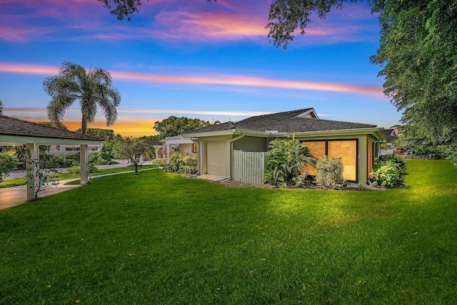 3596 Freshwater Dr, Jupiter, FL 33477 - view of green lawn featuring a garage