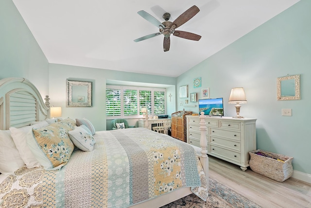 3596 Freshwater Dr, Jupiter, FL 33477 - bedroom with wood finished floors, vaulted ceiling, and a ceiling fan