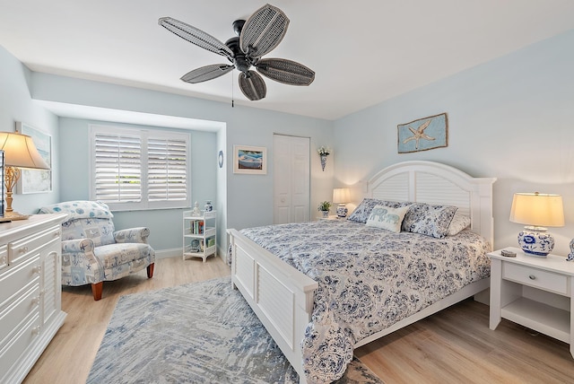 3596 Freshwater Dr, Jupiter, FL 33477 - bedroom with light wood-style floors, a ceiling fan, and a closet