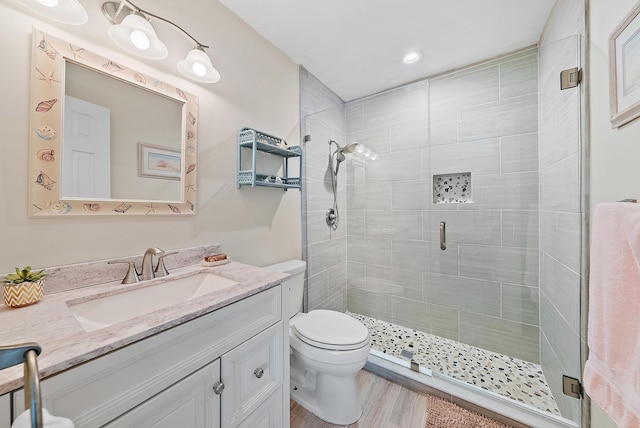 3596 Freshwater Dr, Jupiter, FL 33477 - bathroom featuring vanity, a stall shower, and wood finished floors
