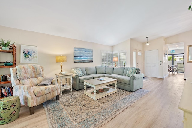 3596 Freshwater Dr, Jupiter, FL 33477 - living room with light wood finished floors and lofted ceiling