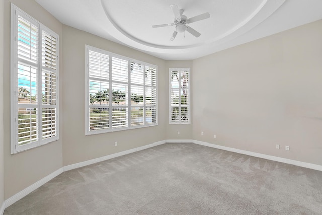 9724 Via Grandezza, Wellington, FL 33411 - empty room featuring carpet flooring, plenty of natural light, ceiling fan, and a raised ceiling