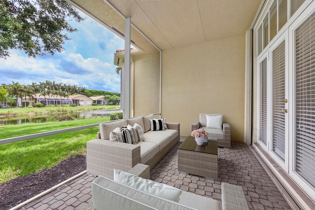 9724 Via Grandezza, Wellington, FL 33411 - view of patio featuring a water view and an outdoor hangout area