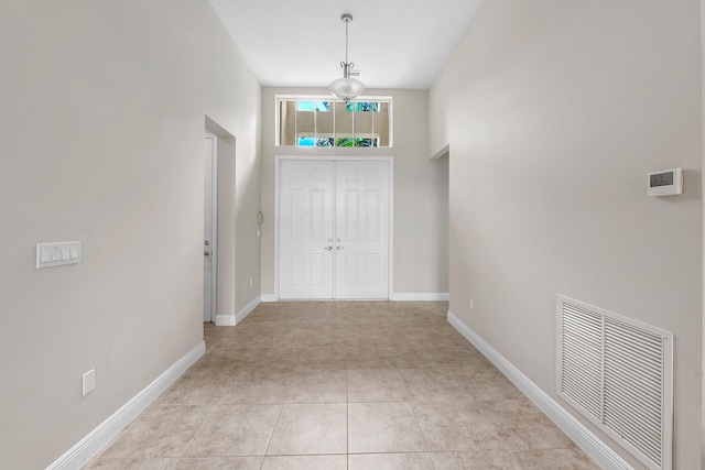 9724 Via Grandezza, Wellington, FL 33411 - entrance foyer featuring baseboards and light tile patterned floors