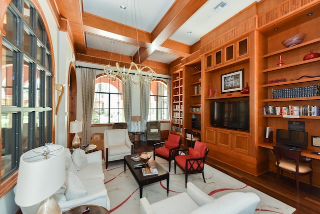 9724 Via Grandezza, Wellington, FL 33411 - living area with wood finished floors, coffered ceiling, built in features, beam ceiling, and a chandelier