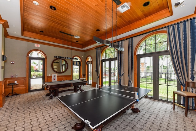 9724 Via Grandezza, Wellington, FL 33411 - playroom featuring a raised ceiling, wooden ceiling, a wainscoted wall, healthy amount of natural light, and a towering ceiling