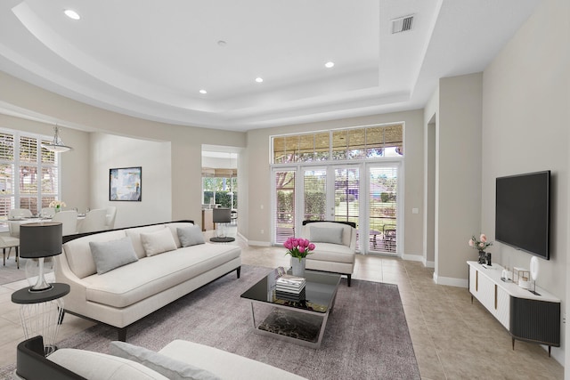 9724 Via Grandezza, Wellington, FL 33411 - living area featuring a tray ceiling, light tile patterned floors, and recessed lighting