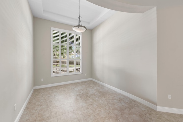 9724 Via Grandezza, Wellington, FL 33411 - unfurnished room featuring light tile patterned floors and a raised ceiling