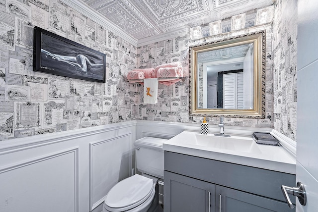 1605 S US Highway 1 Unit F202, Jupiter, FL 33477 - half bathroom featuring vanity, wallpapered walls, an ornate ceiling, and crown molding