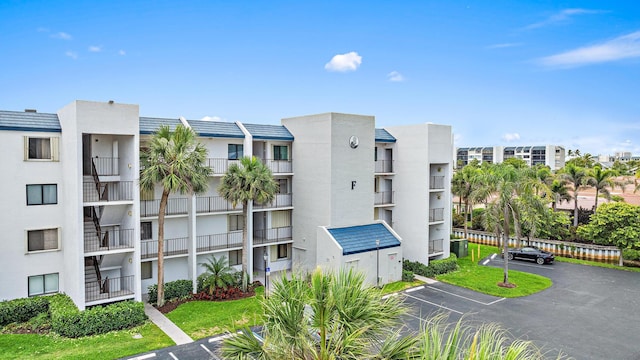 1605 S US Highway 1 Unit F202, Jupiter, FL 33477 - view of apartment building / complex featuring uncovered parking