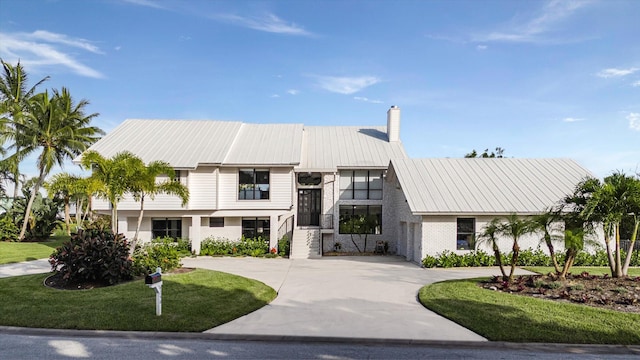 4290 SE Whiticar Way, Stuart, FL 34997 - view of building exterior with curved driveway