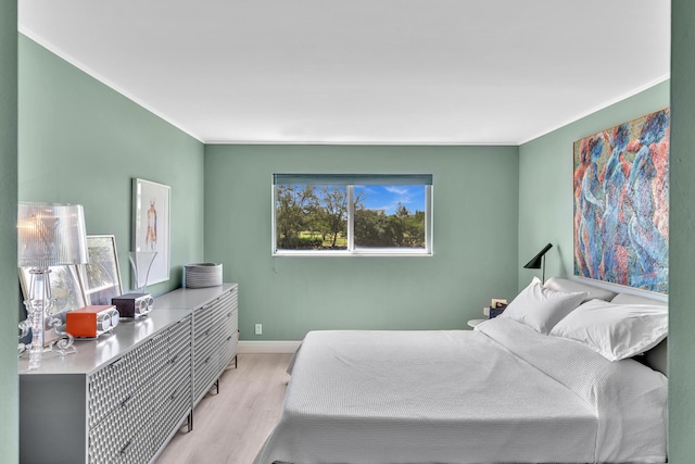 2 Colonial Club Dr Unit 203, Boynton Beach, FL 33435 - bedroom with wood finished floors and ornamental molding