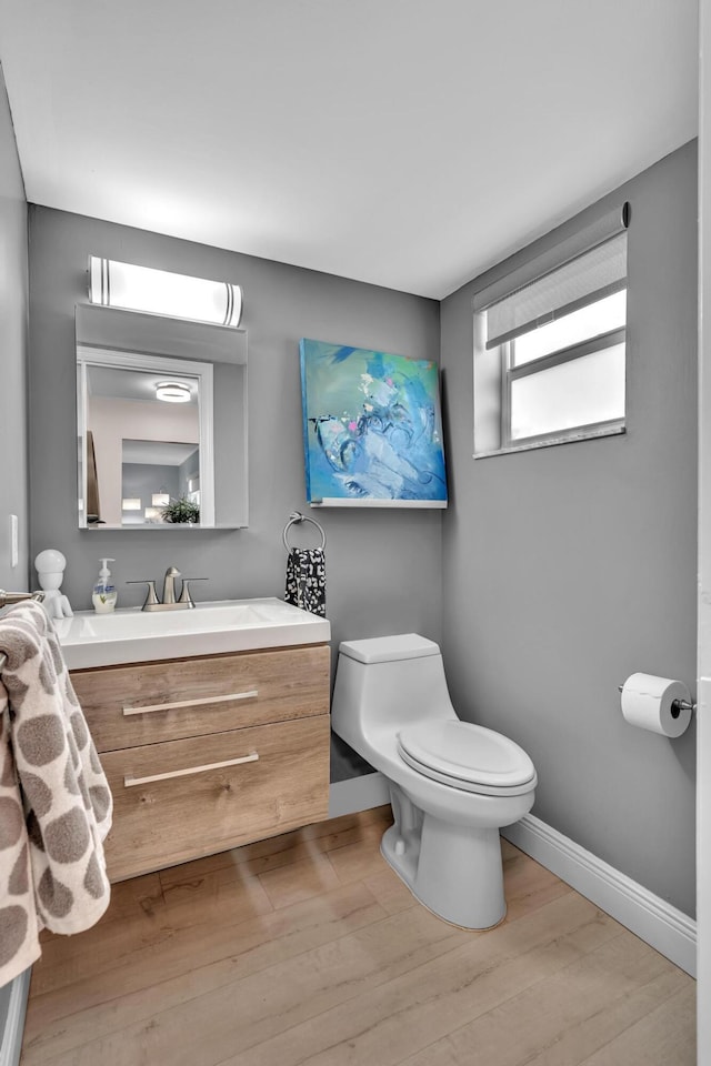 2 Colonial Club Dr Unit 203, Boynton Beach, FL 33435 - half bath featuring vanity and wood finished floors