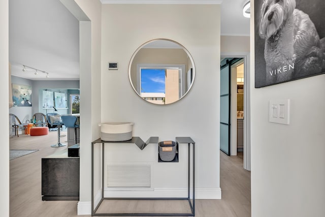 2 Colonial Club Dr Unit 203, Boynton Beach, FL 33435 - corridor featuring wood finished floors and rail lighting