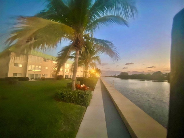 2 Colonial Club Dr Unit 203, Boynton Beach, FL 33435 - surrounding community featuring a water view and a yard