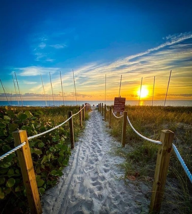 2 Colonial Club Dr Unit 203, Boynton Beach, FL 33435 - dock featuring a water view