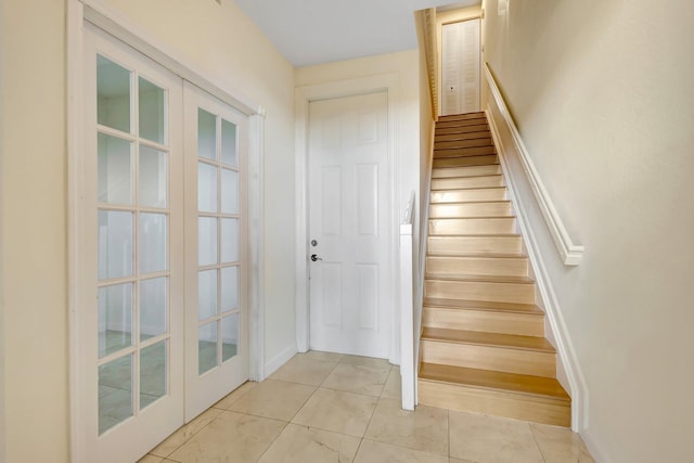 770 Millbrae 4 Ct Unit 4, West Palm Beach, FL 33401 - staircase with french doors and baseboards