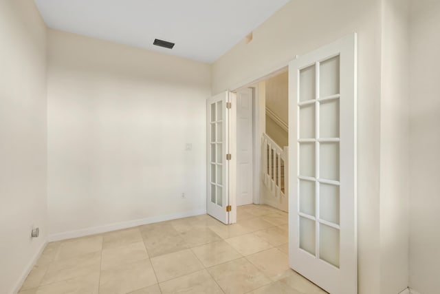 770 Millbrae 4 Ct Unit 4, West Palm Beach, FL 33401 - unfurnished room featuring french doors and light tile patterned flooring