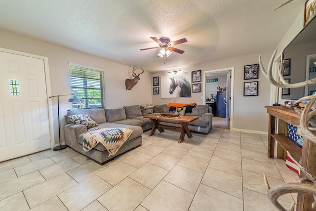 1450 SW 28th St, Okeechobee, FL 34974 - living room with ceiling fan, a textured ceiling, and light tile patterned floors