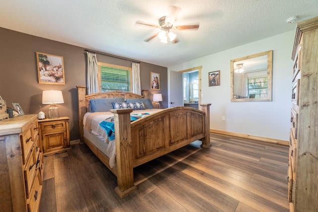 1450 SW 28th St, Okeechobee, FL 34974 - bedroom featuring dark wood finished floors, ceiling fan, and a textured ceiling