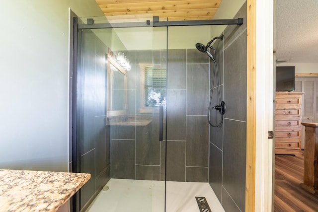 1450 SW 28th St, Okeechobee, FL 34974 - full bathroom featuring a shower stall, wood finished floors, and vanity