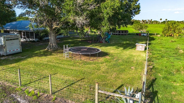 1450 SW 28th St, Okeechobee, FL 34974 - view of yard with a trampoline