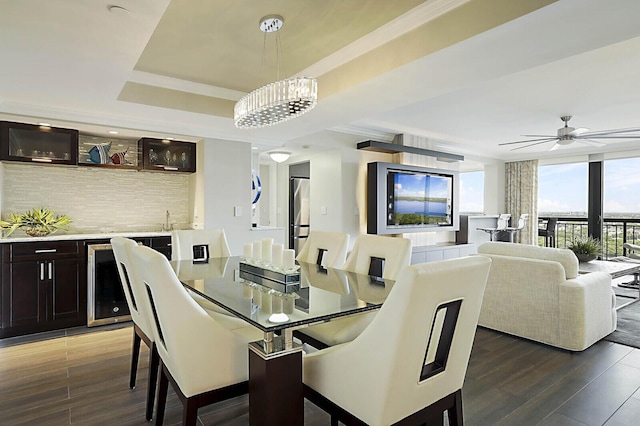 2001 N Ocean Blvd Unit 1804, Boca Raton, FL 33431 - dining space with wine cooler, wood finished floors, a tray ceiling, and a ceiling fan