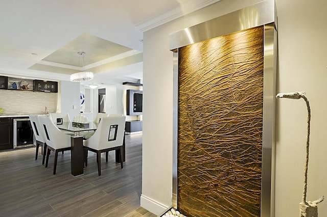 2001 N Ocean Blvd Unit 1804, Boca Raton, FL 33431 - dining space with wine cooler, a raised ceiling, dark wood finished floors, and bar area