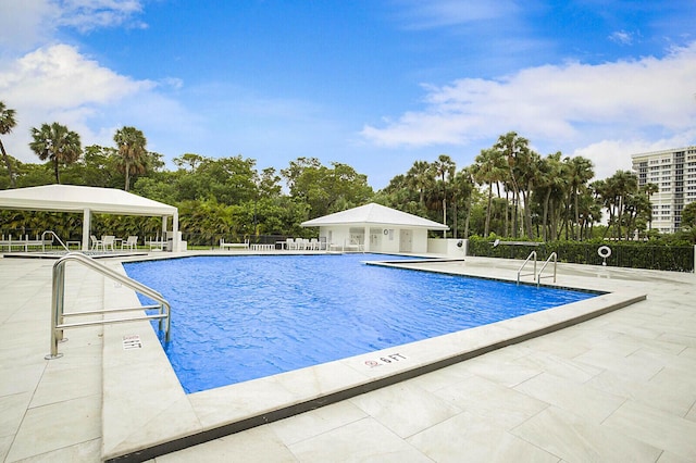 2001 N Ocean Blvd Unit 1804, Boca Raton, FL 33431 - community pool featuring a patio area and view of wooded area