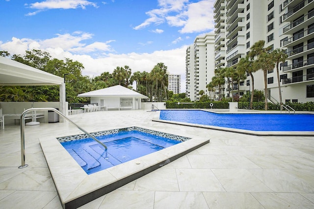 2001 N Ocean Blvd Unit 1804, Boca Raton, FL 33431 - community pool with a community hot tub, a patio, and a view of city