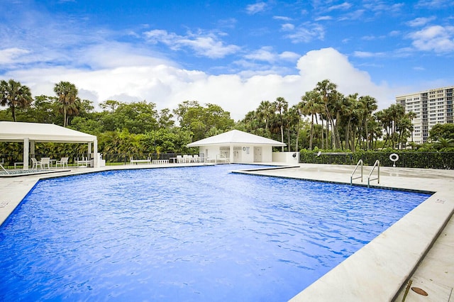 2001 N Ocean Blvd Unit 1804, Boca Raton, FL 33431 - community pool featuring a patio area, view of scattered trees, and a gazebo