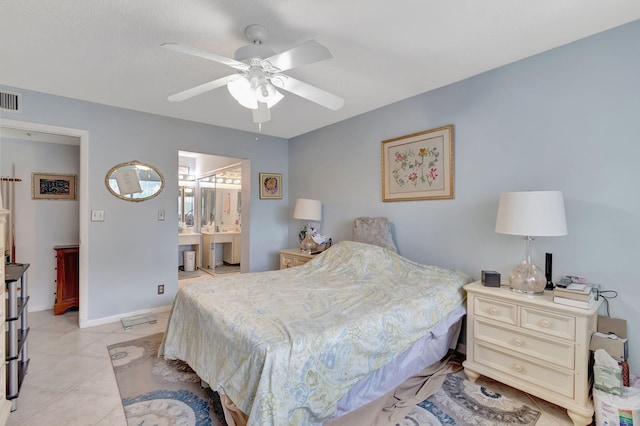15401 Pembridge Ave Unit 9, Delray Beach, FL 33484 - bedroom with light tile patterned floors, ceiling fan, and ensuite bath