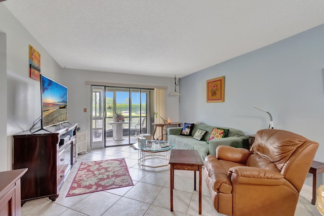 15401 Pembridge Ave Unit 9, Delray Beach, FL 33484 - living area with light tile patterned floors and a textured ceiling