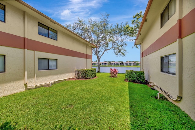 15401 Pembridge Ave Unit 9, Delray Beach, FL 33484 - view of grassy yard with a water view