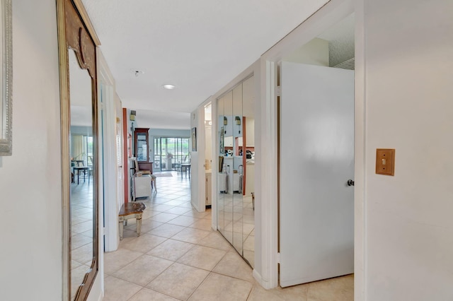 15401 Pembridge Ave Unit 9, Delray Beach, FL 33484 - corridor featuring light tile patterned floors