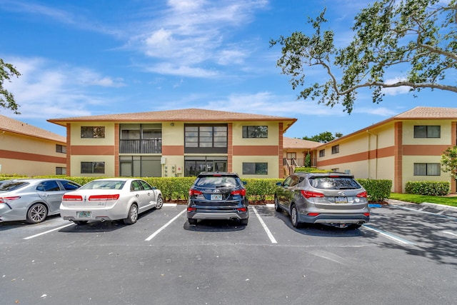 15401 Pembridge Ave Unit 9, Delray Beach, FL 33484 - view of property featuring uncovered parking