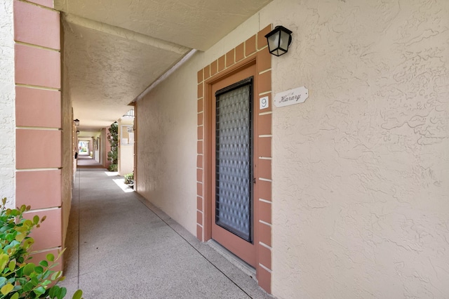 15401 Pembridge Ave Unit 9, Delray Beach, FL 33484 - view of exterior entry with stucco siding