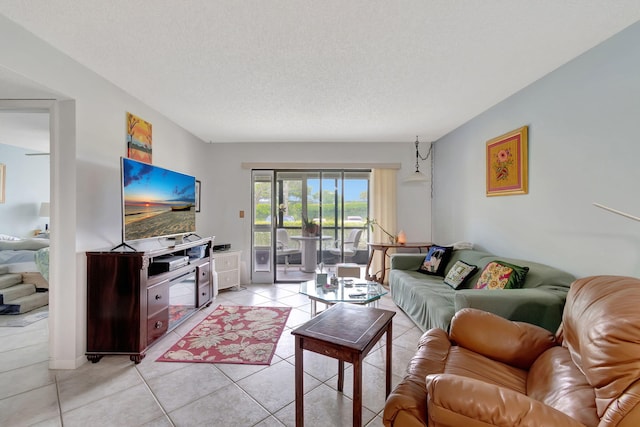 15401 Pembridge Ave Unit 9, Delray Beach, FL 33484 - living area with light tile patterned flooring and a textured ceiling