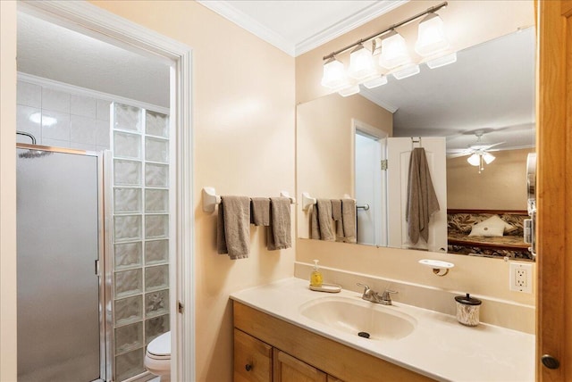 2990 SW Ventura St, Port Saint Lucie, FL 34953 - bathroom with ornamental molding, vanity, a shower stall, a ceiling fan, and ensuite bath